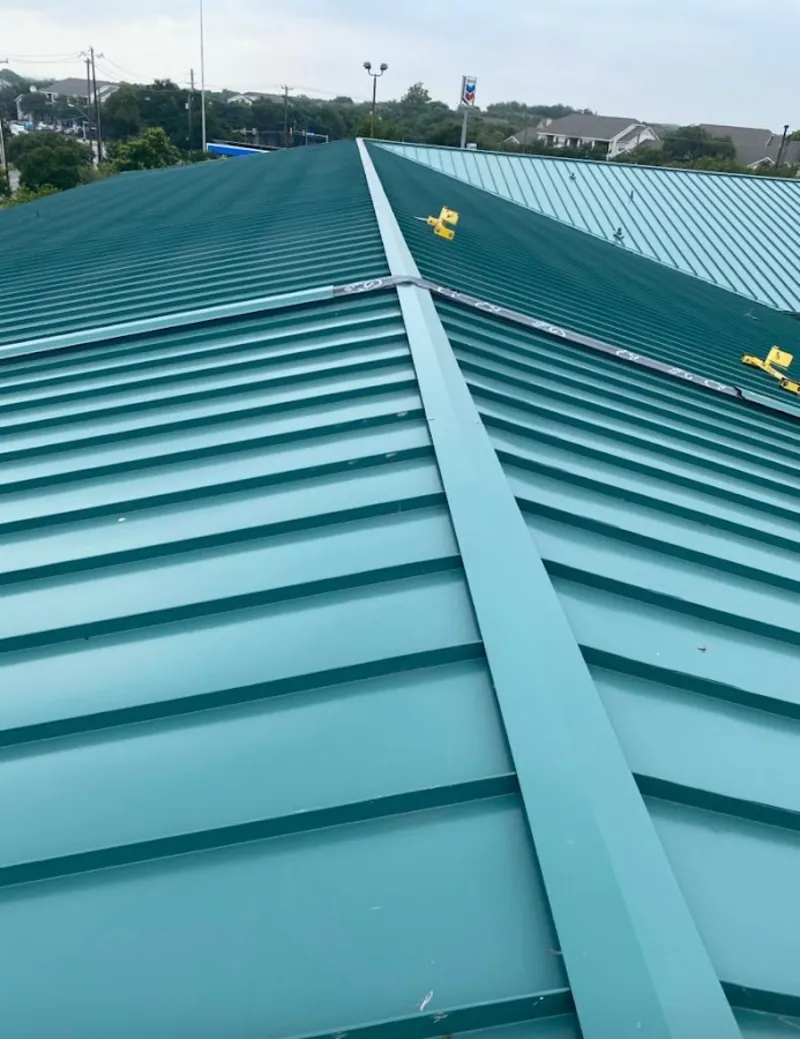 Green commercial metal roof ridge and valley for Metal Roof Repair in Fair Oaks Ranch