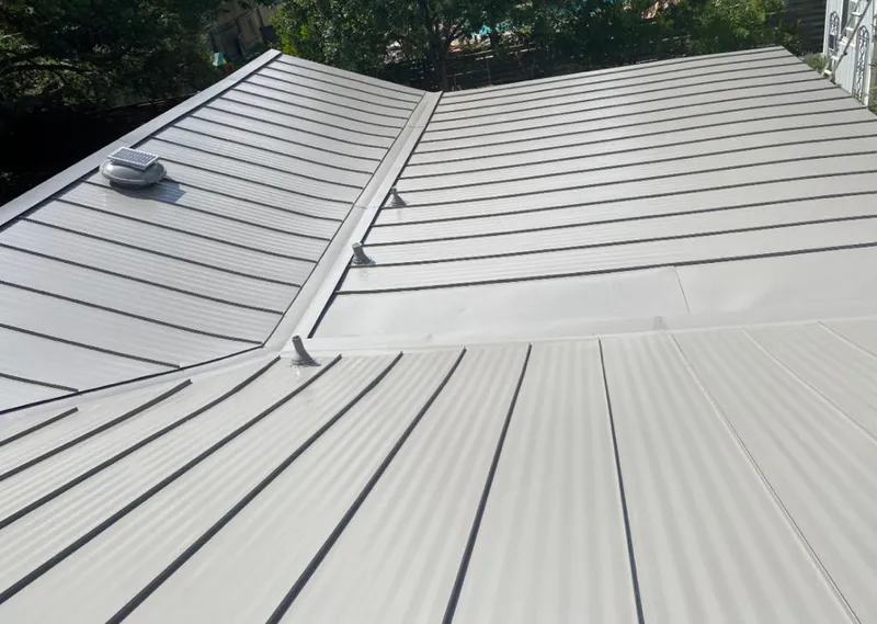 Solar attic fan installed on a metal roof for Roof Ventilation in Fair Oaks Ranch